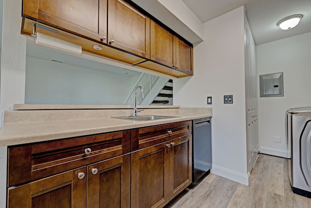 2765 Fox Hollow Ct, Lake Orion, MI 48360 - kitchen featuring dishwashing machine, a sink, light wood finished floors, light countertops, and electric panel
