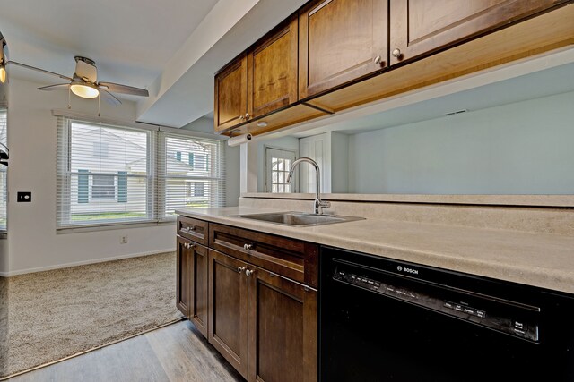2765 Fox Hollow Ct, Lake Orion, MI 48360 - kitchen with dishwasher, a sink, baseboards, light countertops, and ceiling fan