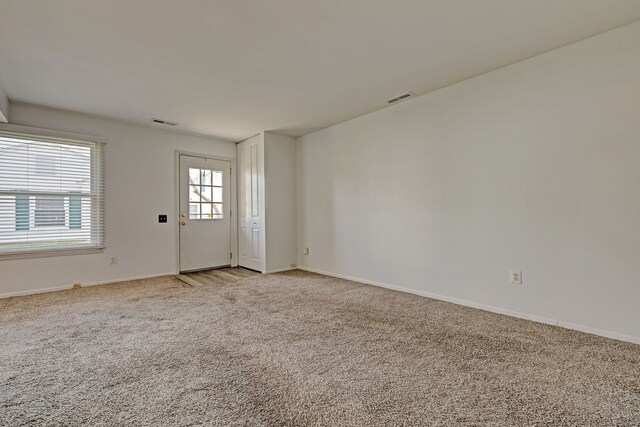 2765 Fox Hollow Ct, Lake Orion, MI 48360 - spare room featuring light carpet and baseboards