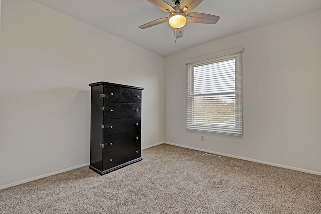 2765 Fox Hollow Ct, Lake Orion, MI 48360 - unfurnished bedroom with carpet flooring, baseboards, and ceiling fan