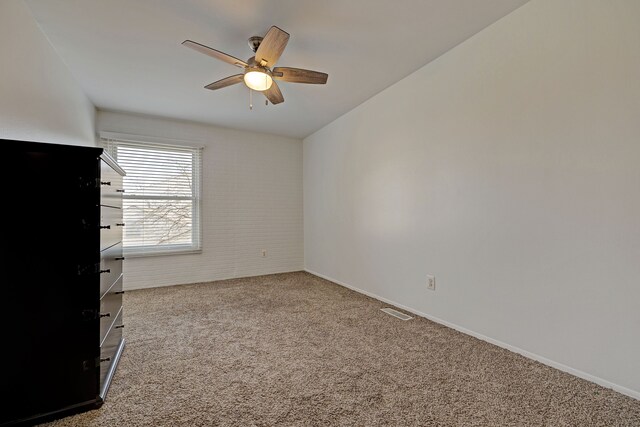 2765 Fox Hollow Ct, Lake Orion, MI 48360 - spare room featuring carpet flooring, ceiling fan, and baseboards