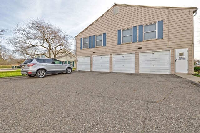 2765 Fox Hollow Ct, Lake Orion, MI 48360 - view of property exterior with asphalt driveway