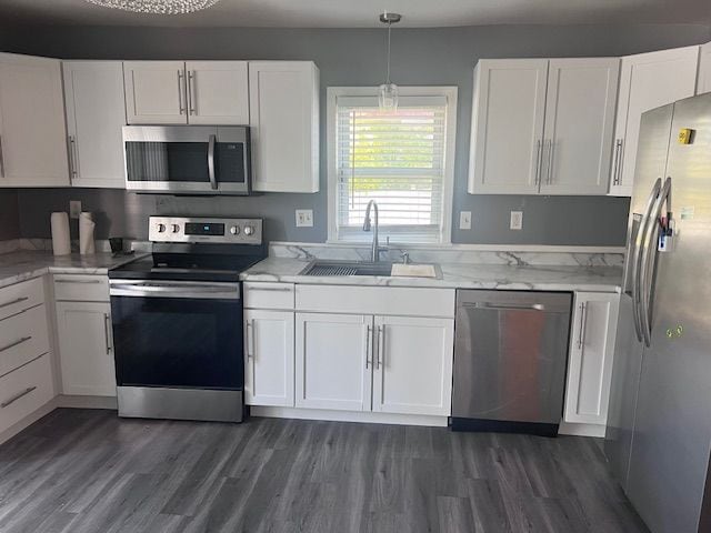 kitchen featuring white cabinetry, sink, stainless steel appliances, and dark hardwood / wood-style floors