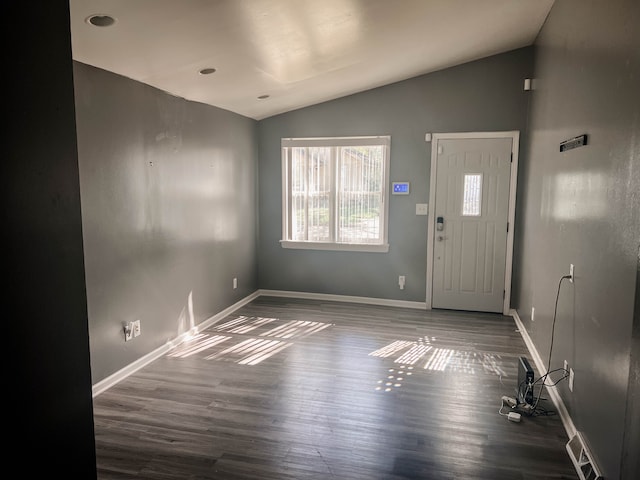 entryway with dark hardwood / wood-style floors and lofted ceiling