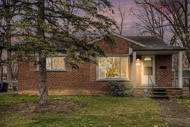 view of front of home with a lawn