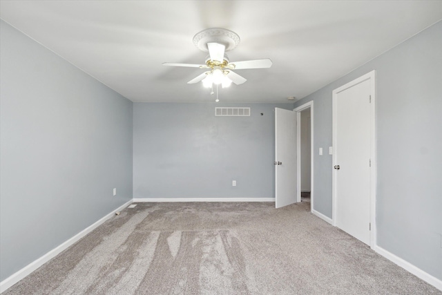 carpeted empty room with ceiling fan