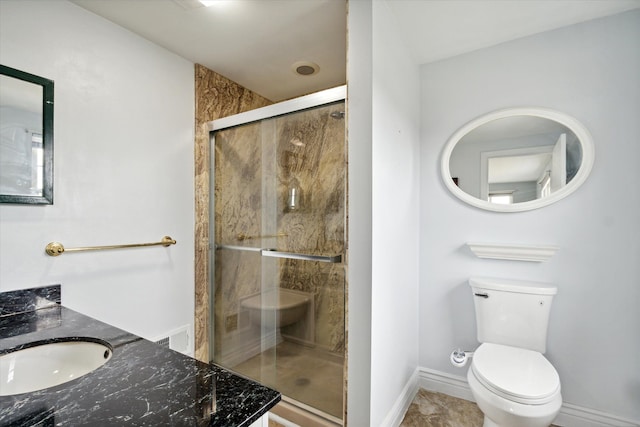 bathroom with tile patterned flooring, vanity, toilet, and walk in shower