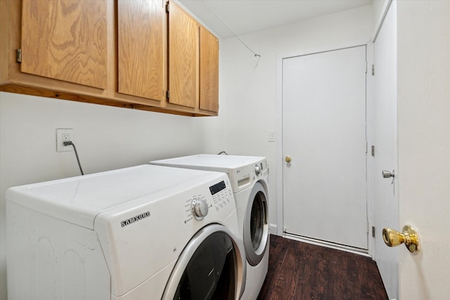 laundry room featuring dark hardwood / wood-style flooring, cabinets, and independent washer and dryer