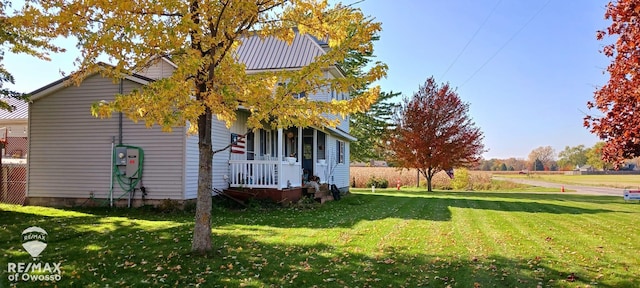 view of home's exterior featuring a yard