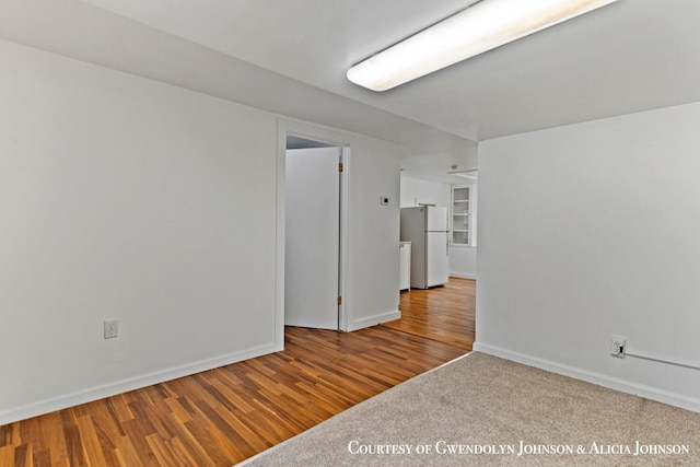 spare room featuring light wood-type flooring