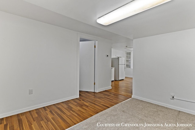 100 Inca Dr SW, Grand Rapids, MI 49548 - unfurnished room with baseboards and wood finished floors