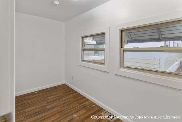 100 Inca Dr SW, Grand Rapids, MI 49548 - unfurnished room featuring baseboards, a smoke detector, and wood finished floors