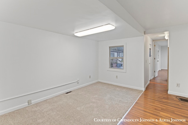 unfurnished room featuring hardwood / wood-style floors