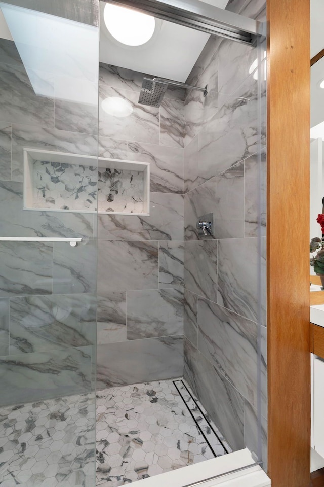 bathroom with tiled shower