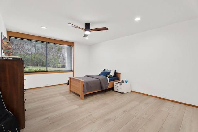 bedroom featuring ceiling fan and light wood-type flooring