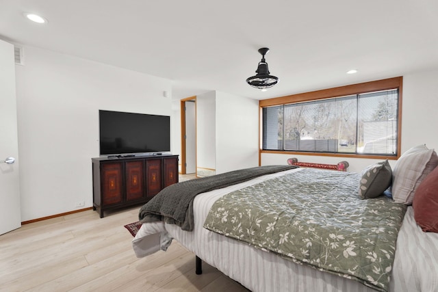 bedroom with light hardwood / wood-style flooring