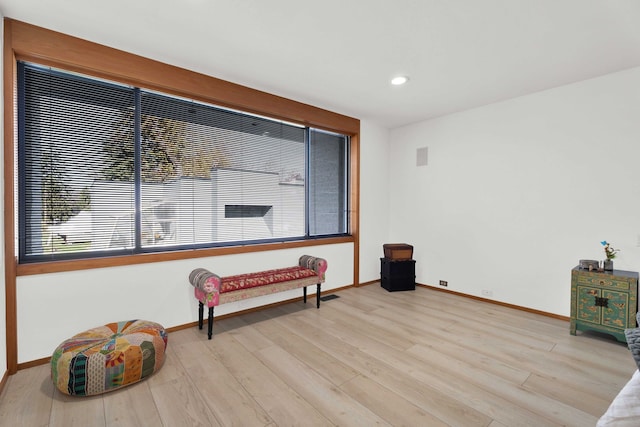 sitting room featuring light hardwood / wood-style floors