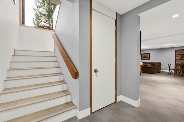 staircase with tile patterned floors