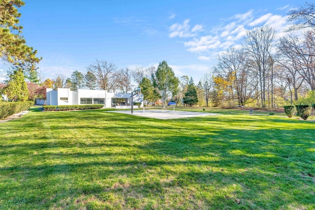 view of yard with basketball court