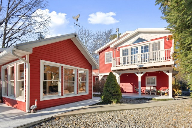 rear view of property with a balcony