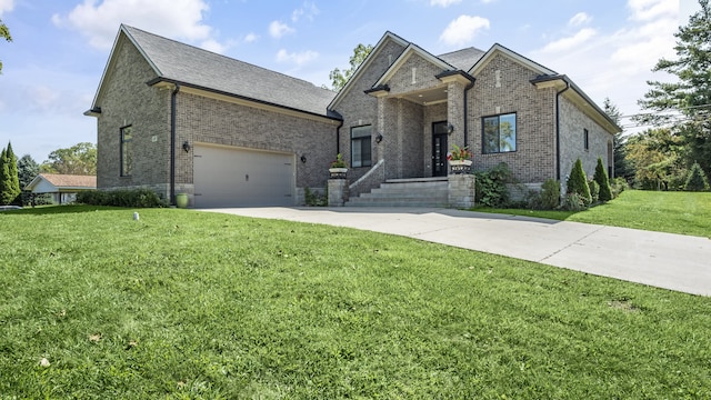 view of front of home featuring a garage and a front yard