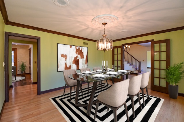 dining room with stairs, baseboards, a notable chandelier, and visible vents