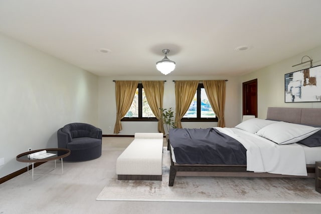 bedroom with light colored carpet