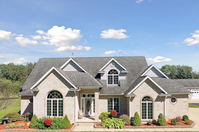 4445 Brogan Rd, Stockbridge, MI 49285 - view of front of property with brick siding and a shingled roof