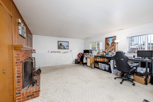 office featuring carpet flooring and a brick fireplace