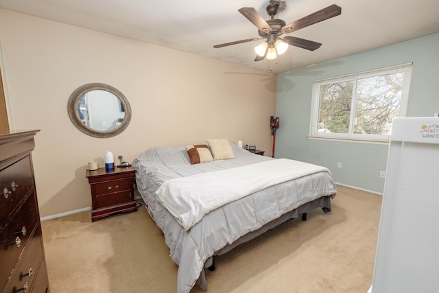 bedroom with light carpet and ceiling fan