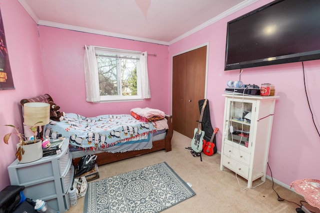 carpeted bedroom featuring crown molding and a closet