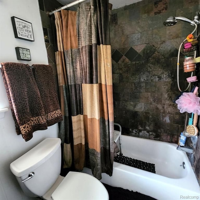 bathroom with shower / bath combo and toilet