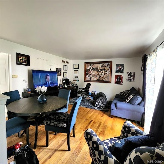 dining room with wood-type flooring