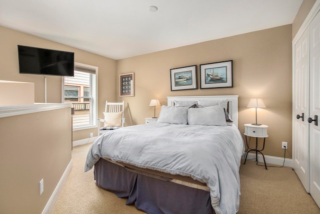 carpeted bedroom featuring a closet