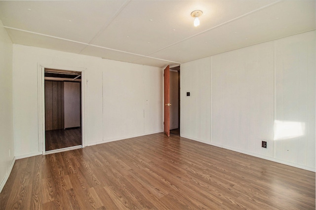 spare room featuring hardwood / wood-style flooring