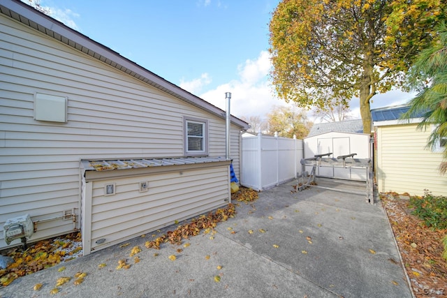 view of property exterior featuring a shed