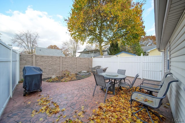 view of patio featuring a grill