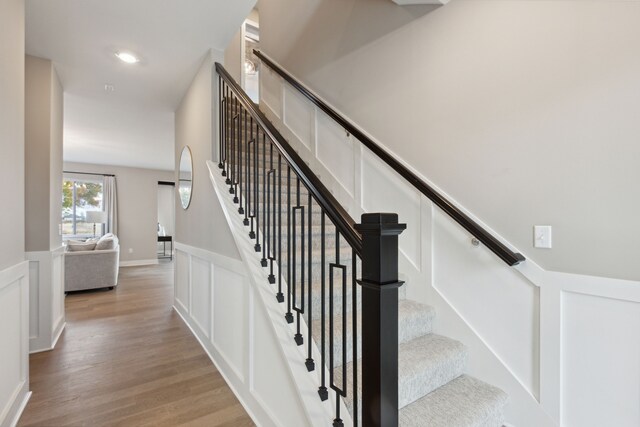 staircase featuring hardwood / wood-style flooring