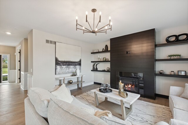 living room featuring a fireplace and light hardwood / wood-style floors