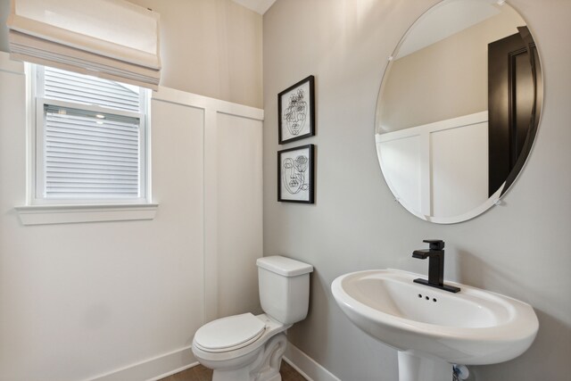 bathroom featuring sink and toilet