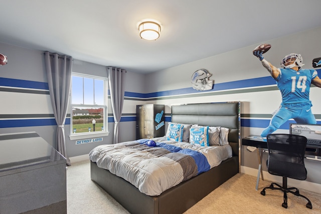 bedroom with carpet flooring and baseboards