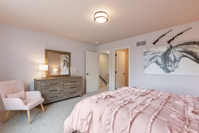 bedroom with light carpet and visible vents