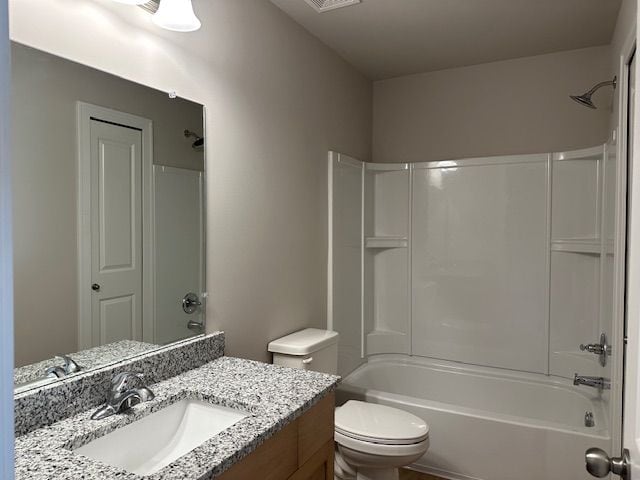 bathroom featuring visible vents, vanity, toilet, and shower / bathtub combination