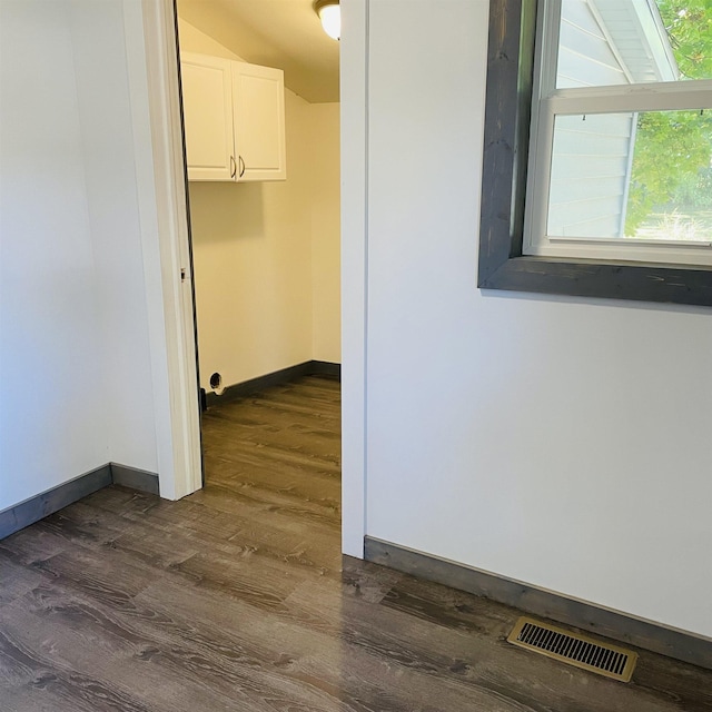 corridor featuring dark wood-type flooring