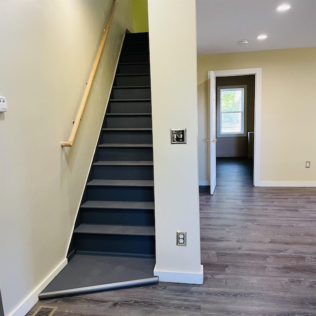 stairway featuring hardwood / wood-style flooring