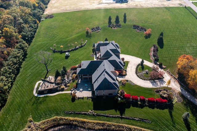 birds eye view of property with a rural view