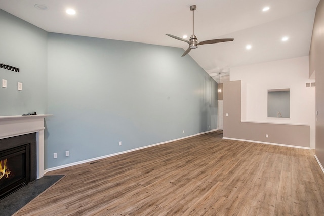 unfurnished living room with ceiling fan, high vaulted ceiling, and hardwood / wood-style flooring