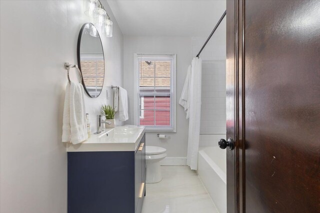 full bathroom featuring shower / tub combo, vanity, and toilet