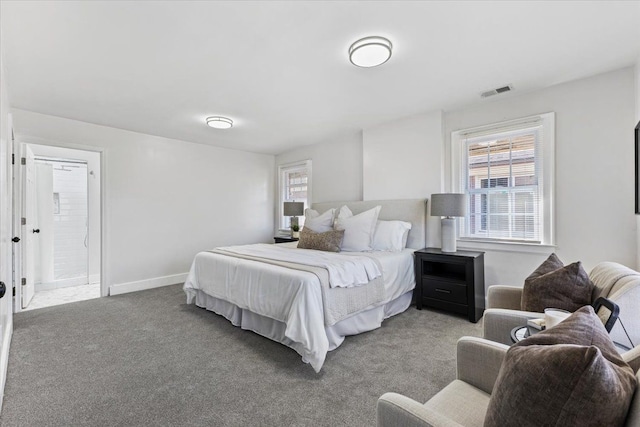 carpeted bedroom with ensuite bathroom