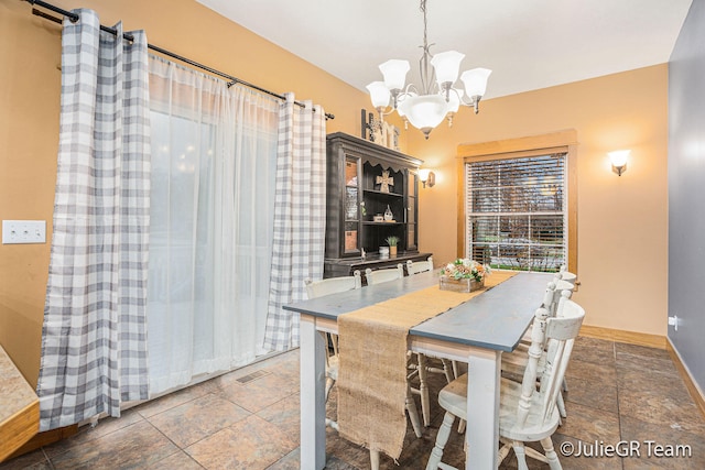 dining room featuring an inviting chandelier